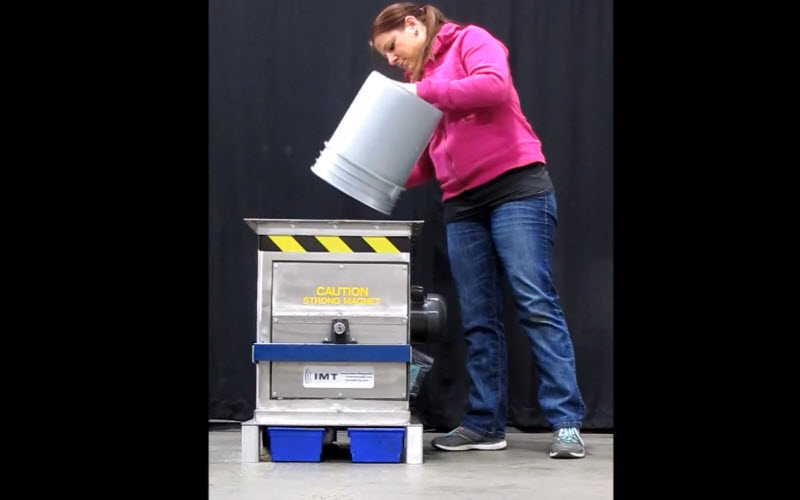 A person emptying a bucket.